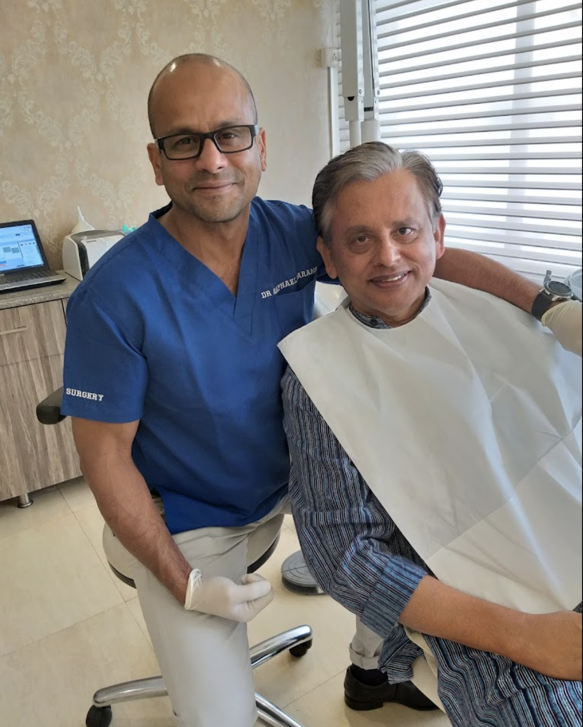 Dr. Raphael Parambi with a patient